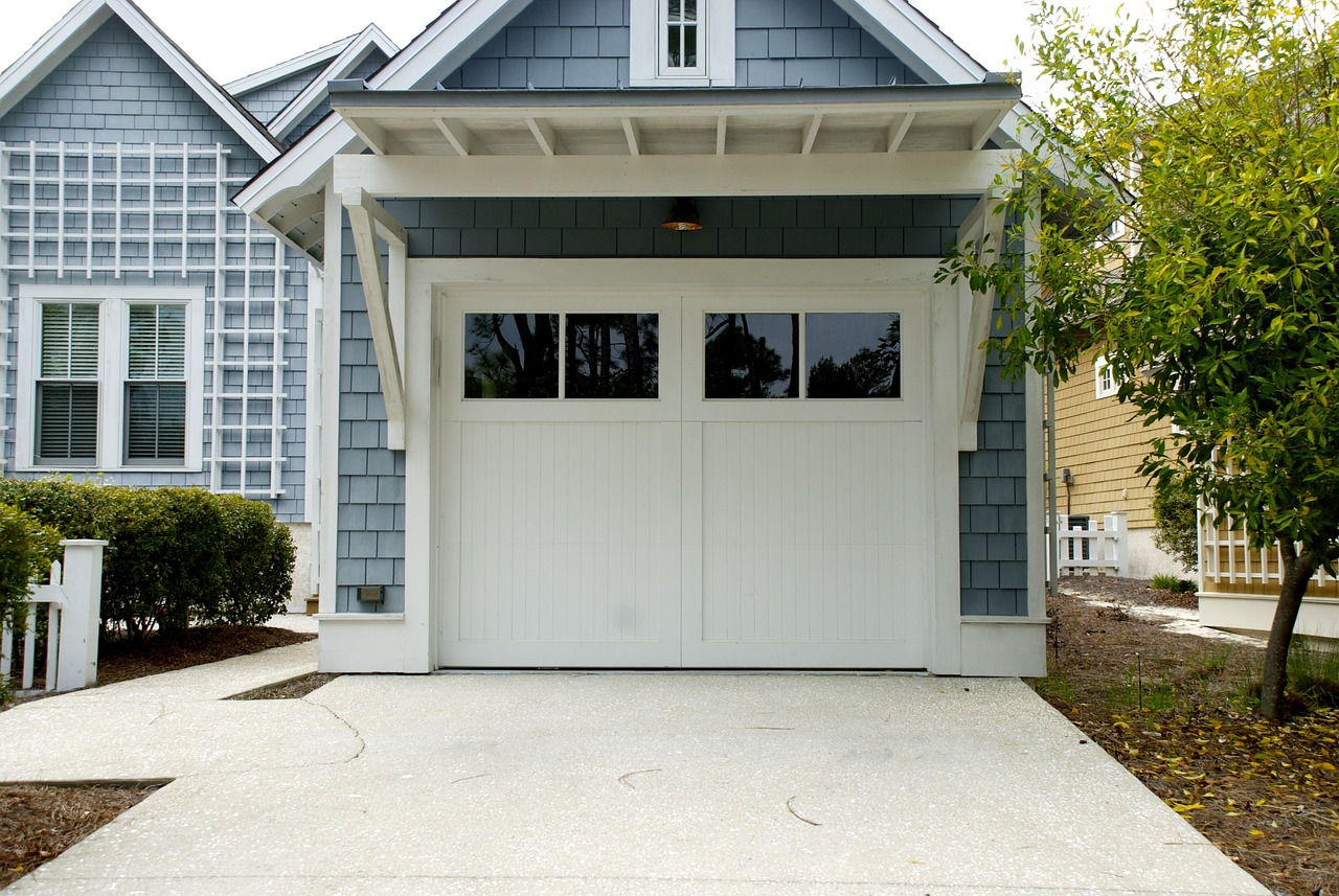 What kind of warranties do garage door repair companies offer for their services and parts?